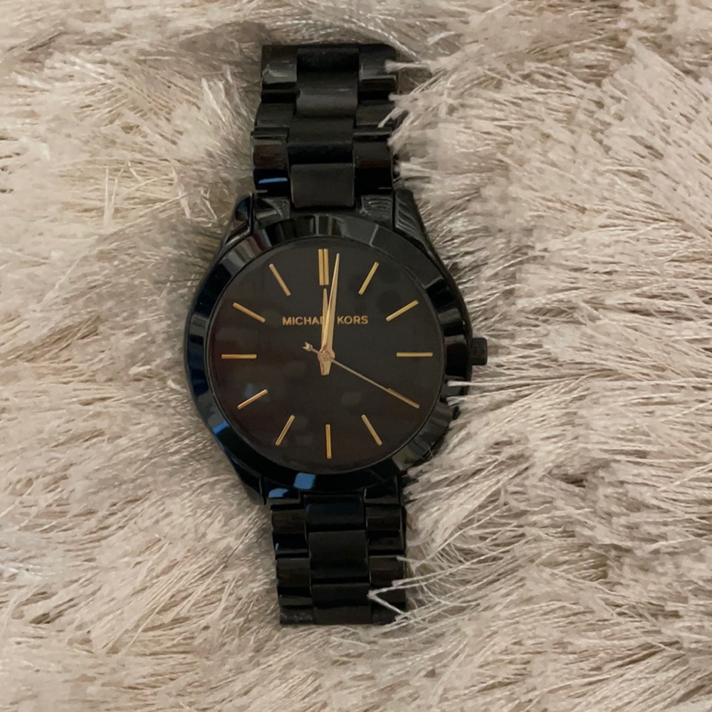 Black Michael Kors watch with gold detail